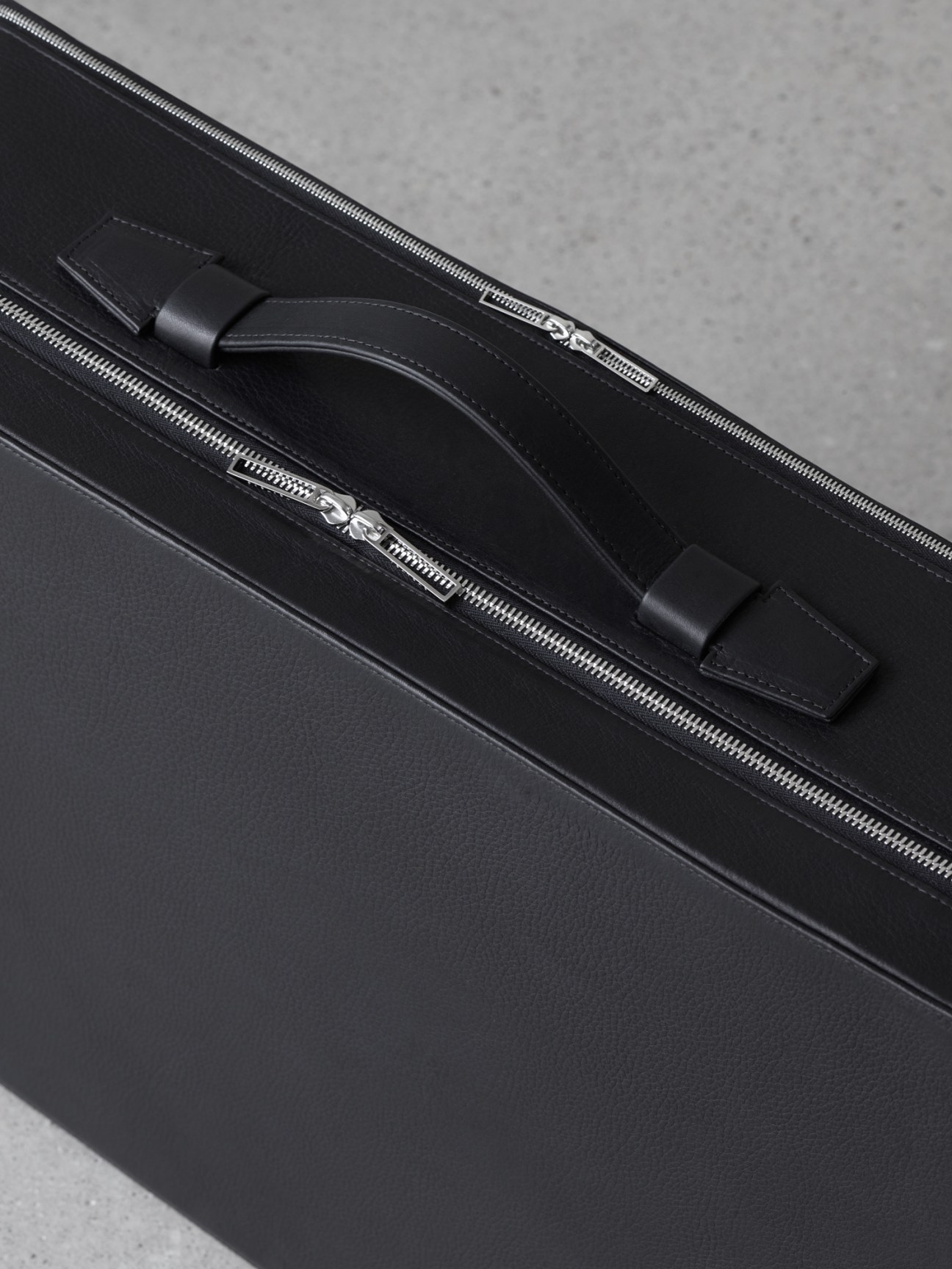 Full view of the black Suit-case with handle extended