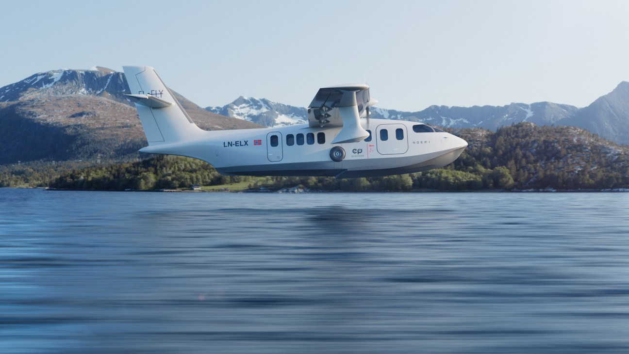 Elfly's Noemi electric seaplane landing on water with Norwegian fjord mountains in background.