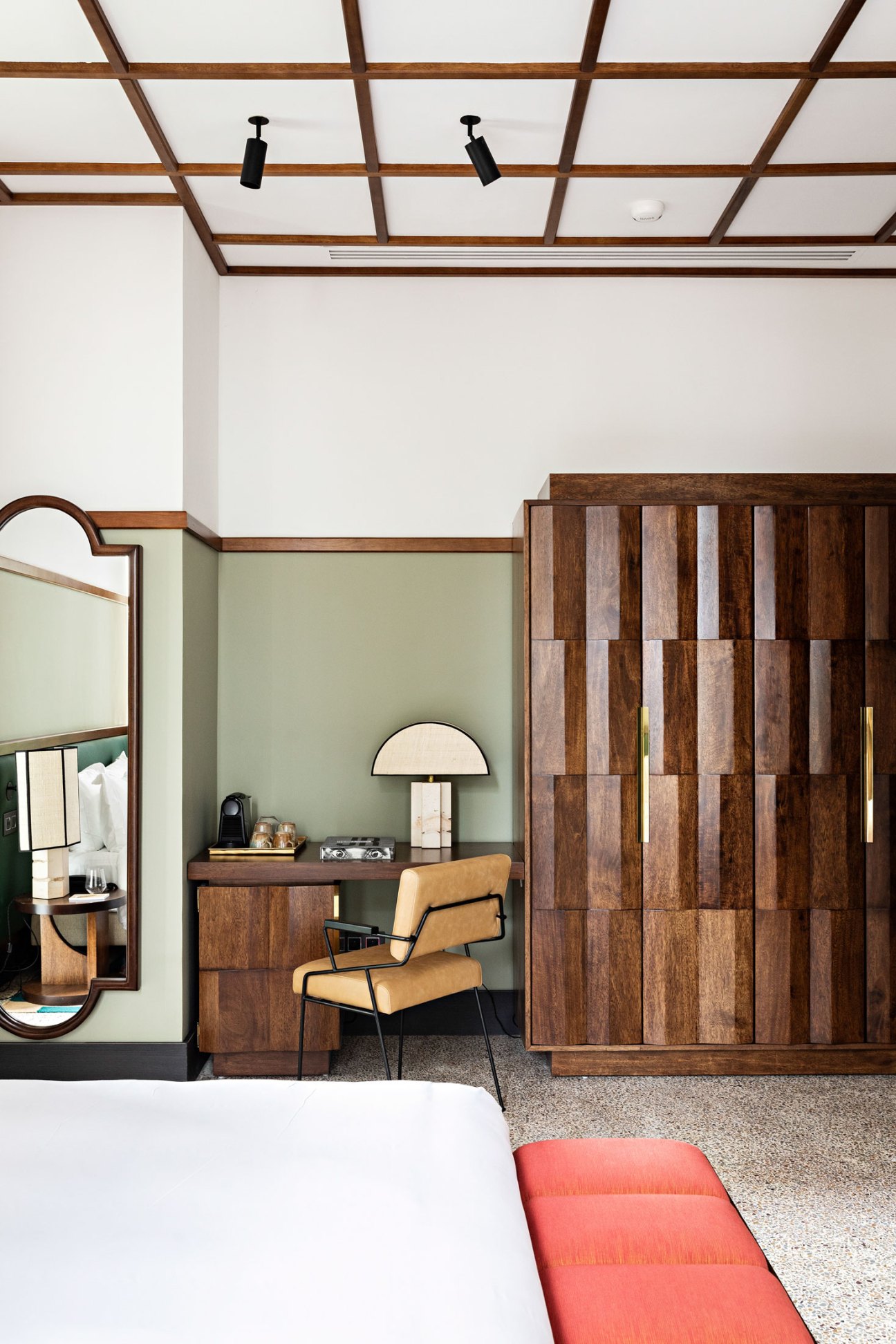 Hotel dining area with rattan furniture by Maxime Liautard and Senegalese textile rugs