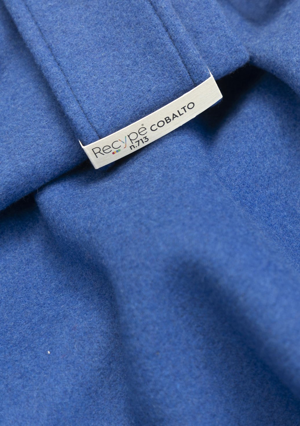 Blue recycled wool fabric with white label reading ReCycle Cobalto n.713