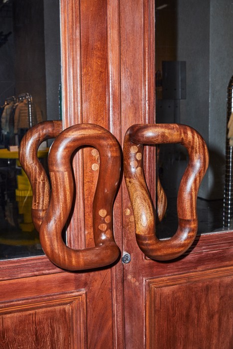Sculptural wooden door handles on Bottega Veneta's New York Soho store entrance.