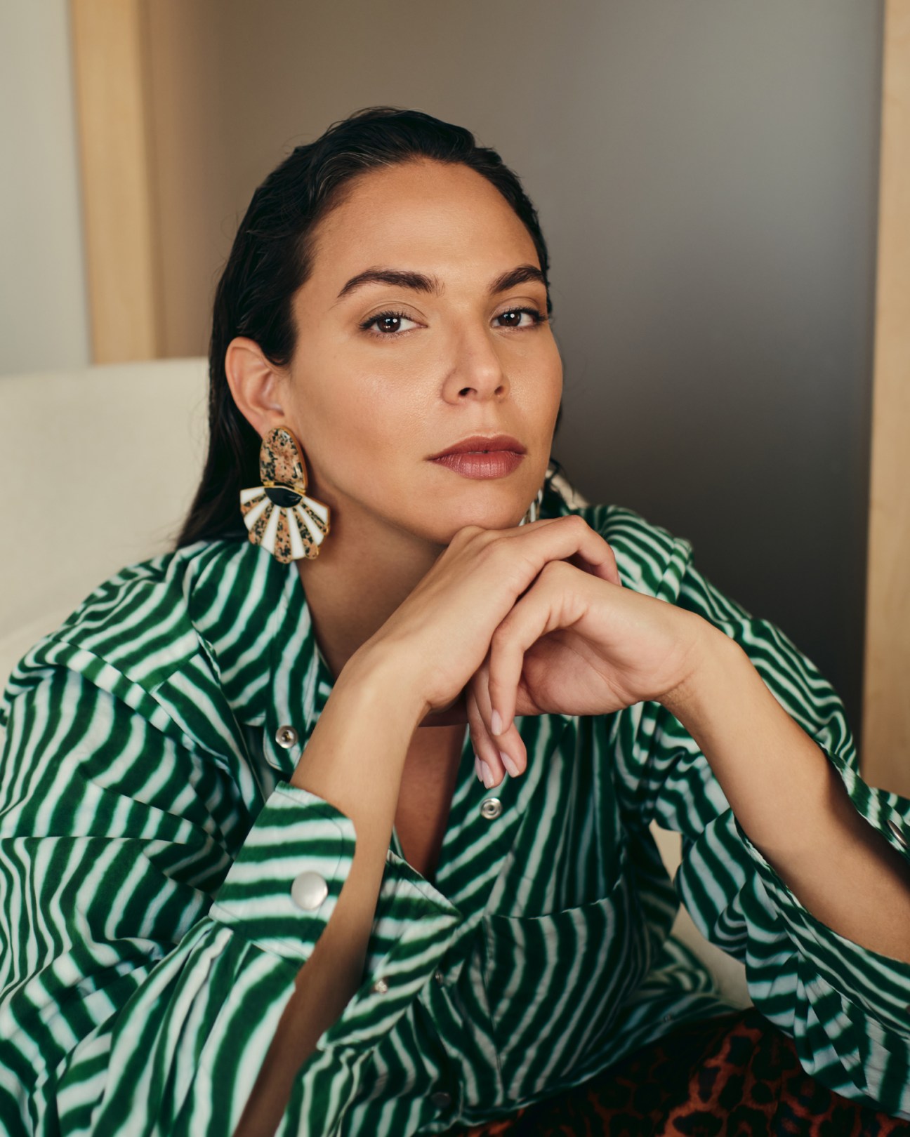 Carolina Alvarez-Mathies, executive director of Dallas Contemporary, wearing striped green shirt and statement earrings