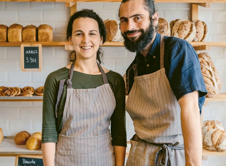 Benedita Saavedra and Adriano Sequeira standing in their Porto bakery Masseira