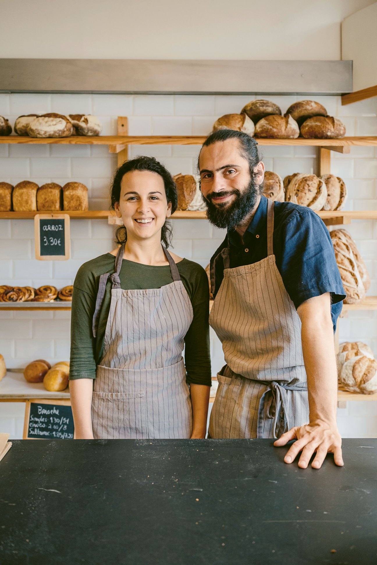 Benedita Saavedra and Adriano Sequeira standing in their Porto bakery Masseira