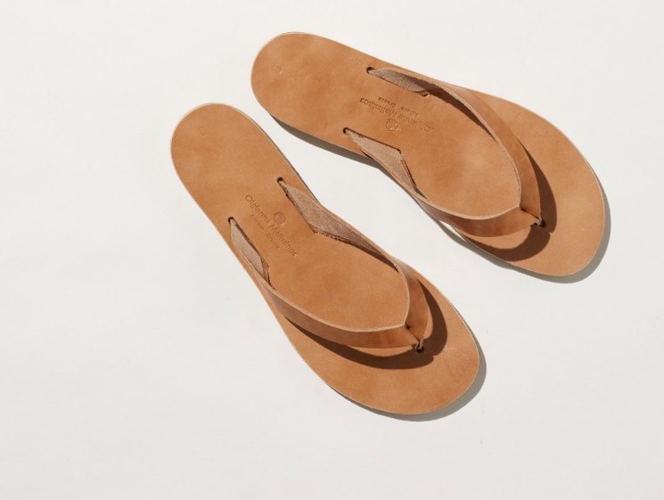 Tan leather sandals from Melissinos workshop showing handcrafted construction and simple thong-style design