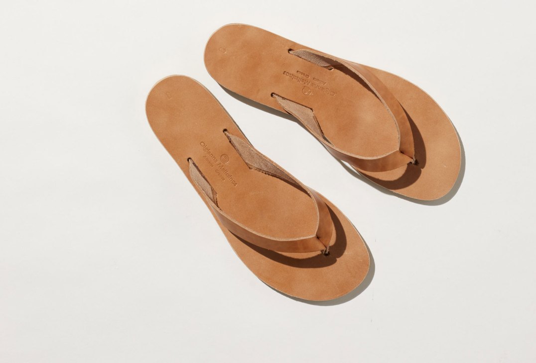 Tan leather sandals from Melissinos workshop showing handcrafted construction and simple thong-style design
