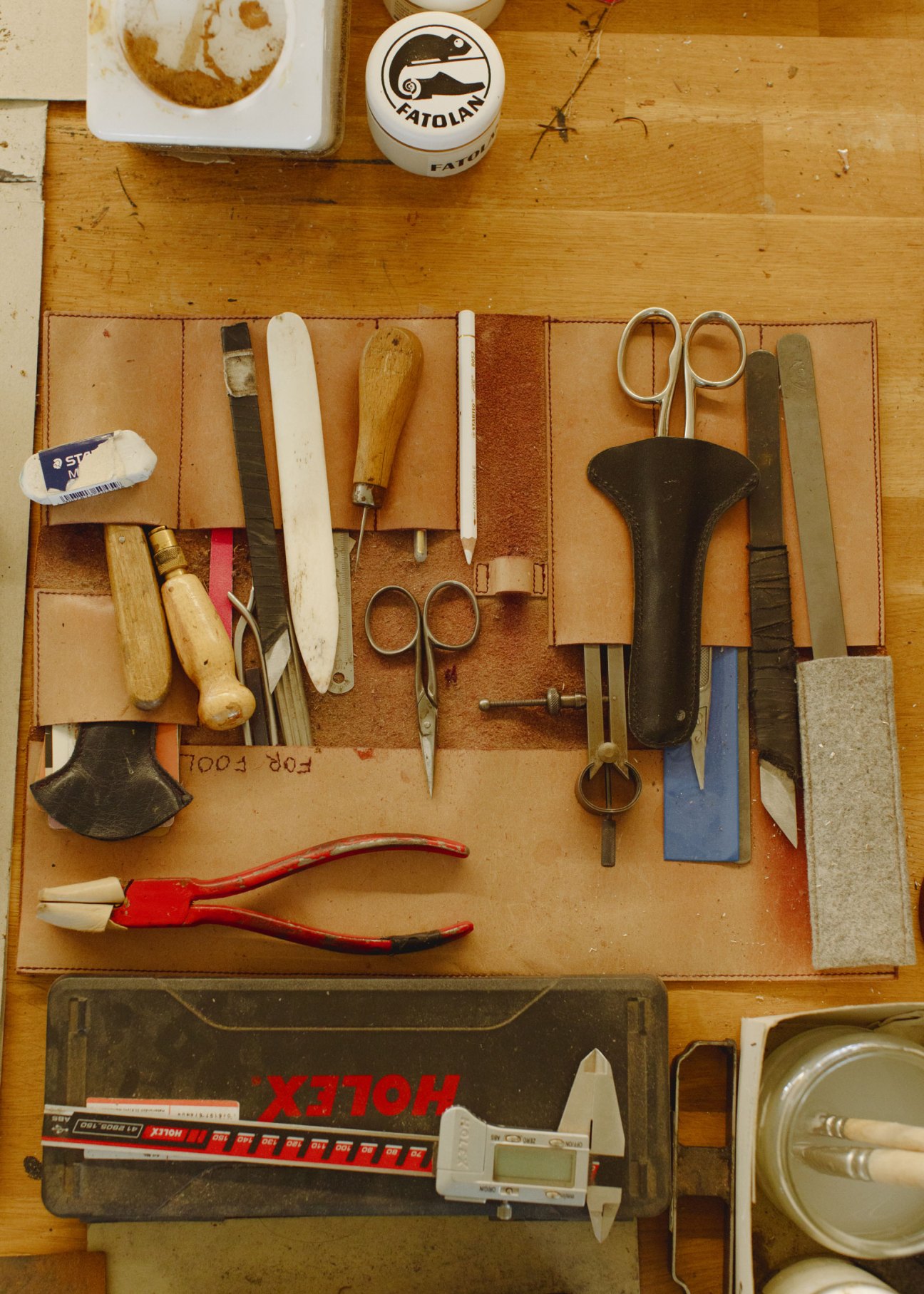 Traditional leather crafting tools and equipment used at Kreis Ledermanufaktur workshop