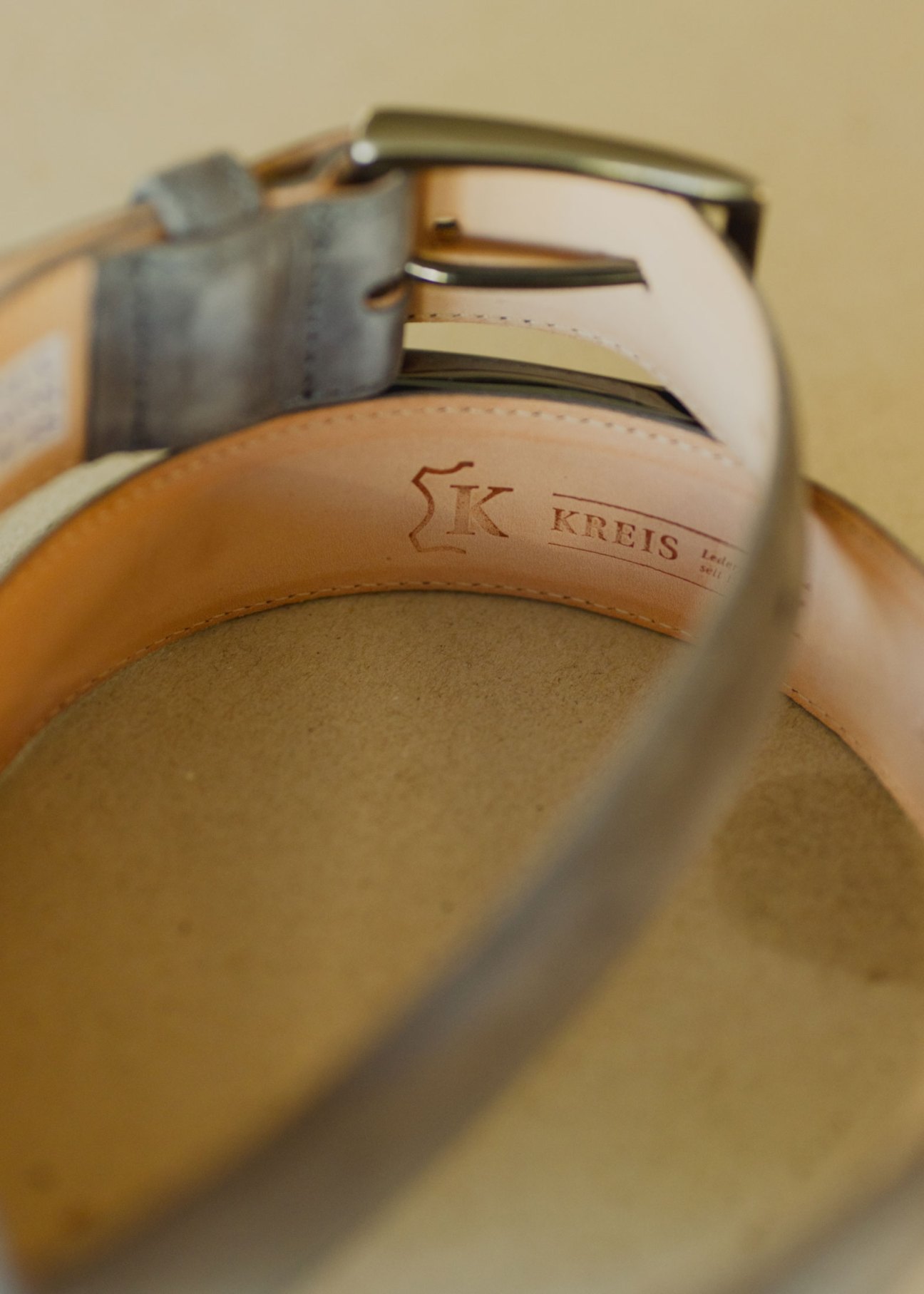 Display of handcrafted leather belts by Kreis Ledermanufaktur showing quality craftsmanship