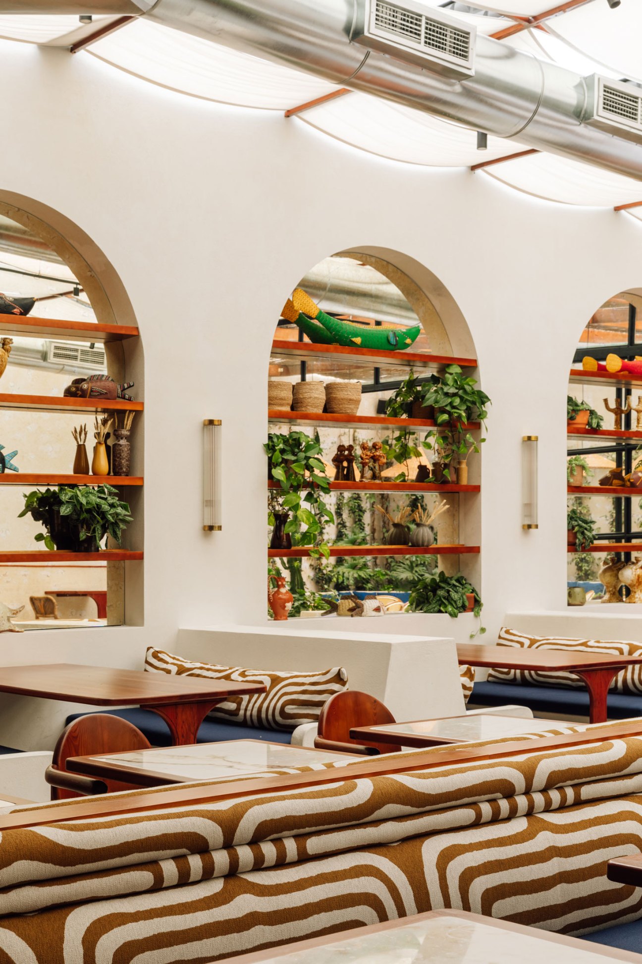 Bright dining room with Crittall glass ceiling at Rosamar restaurant in Lisbon