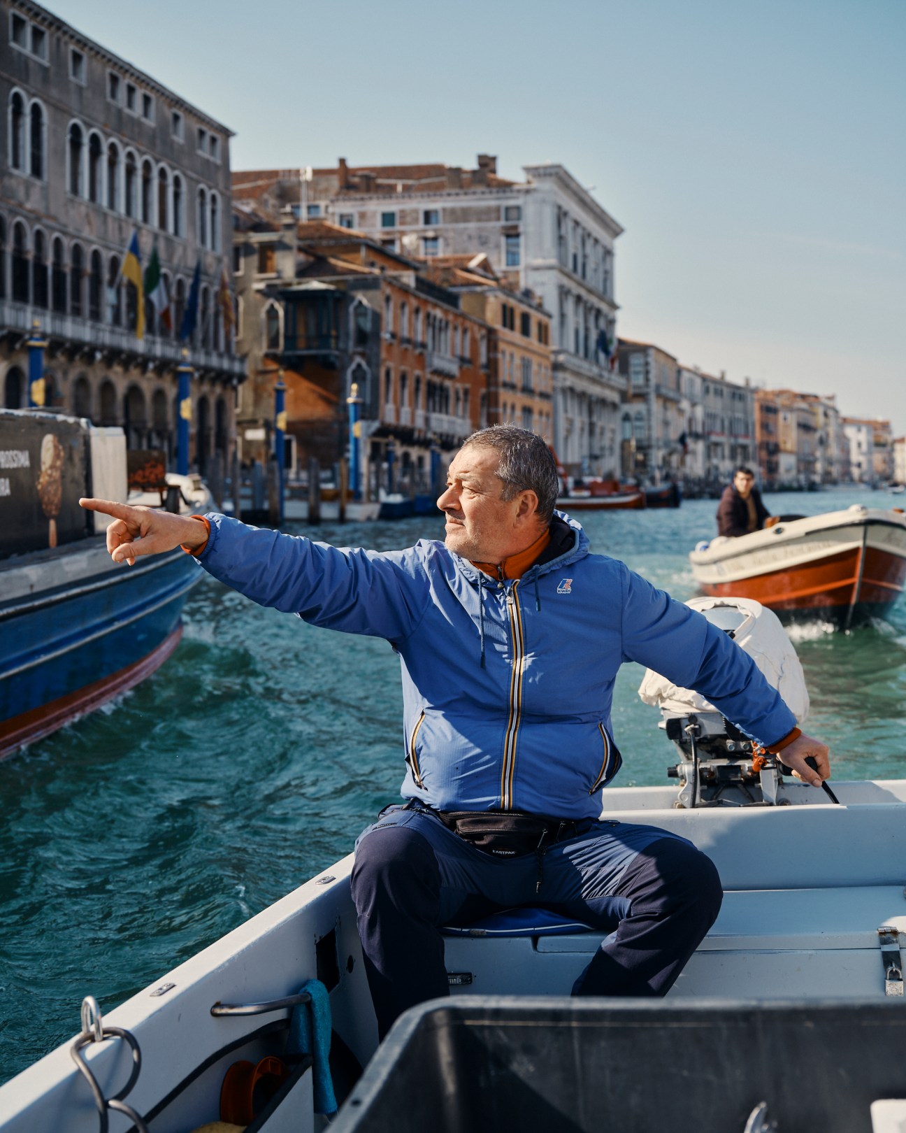 Fishmonger Marco Bergamasco carrying fresh fish at Venice market