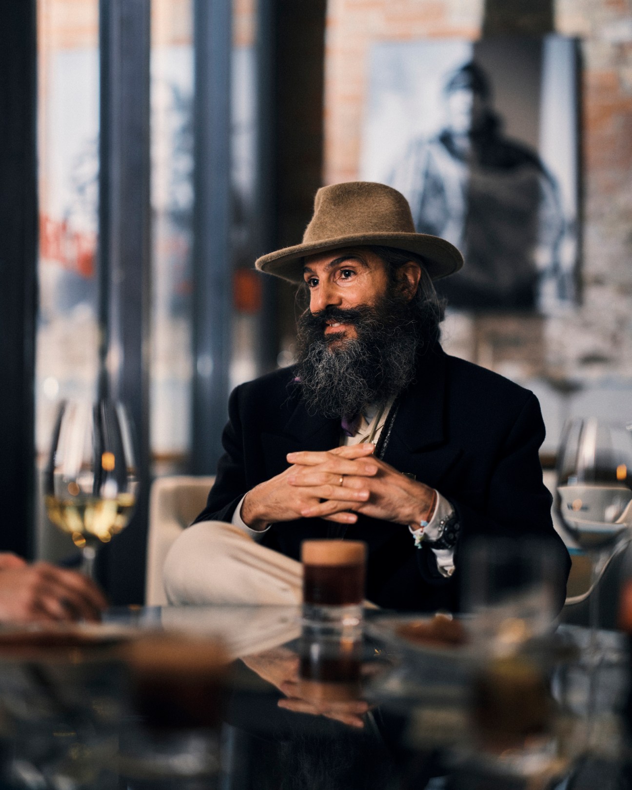 Alessandro Gallo sitting at elegant table at The Venice Venice Hotel with canal view