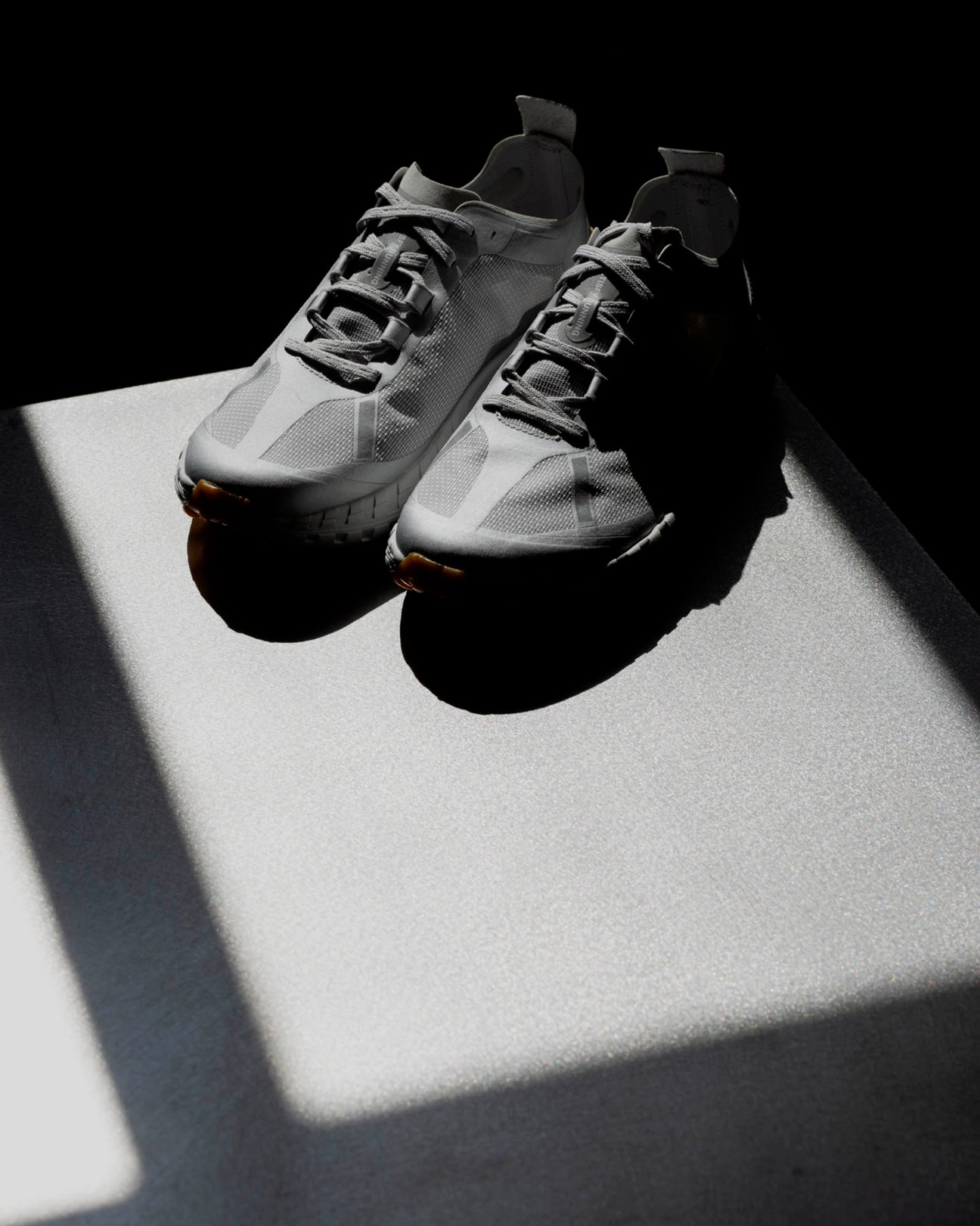 Satisfy Running trail-running shoe with technical design and rugged sole