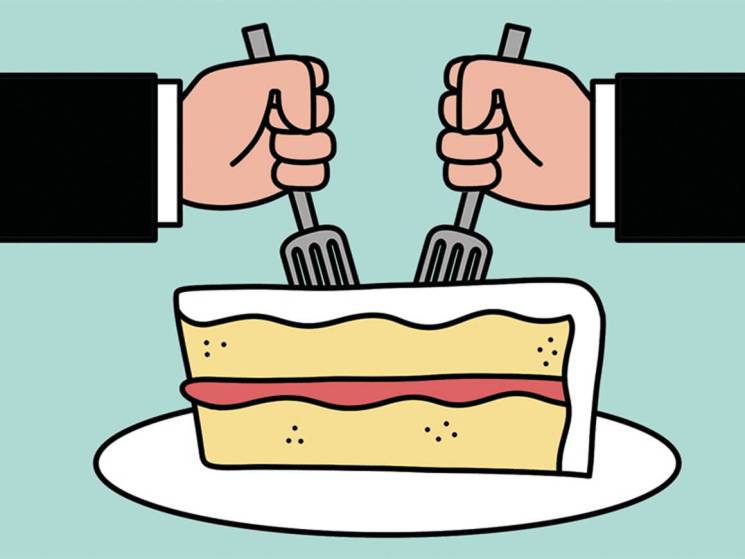 Two hands in business suits holding forks approaching a slice of layered cake on a white plate