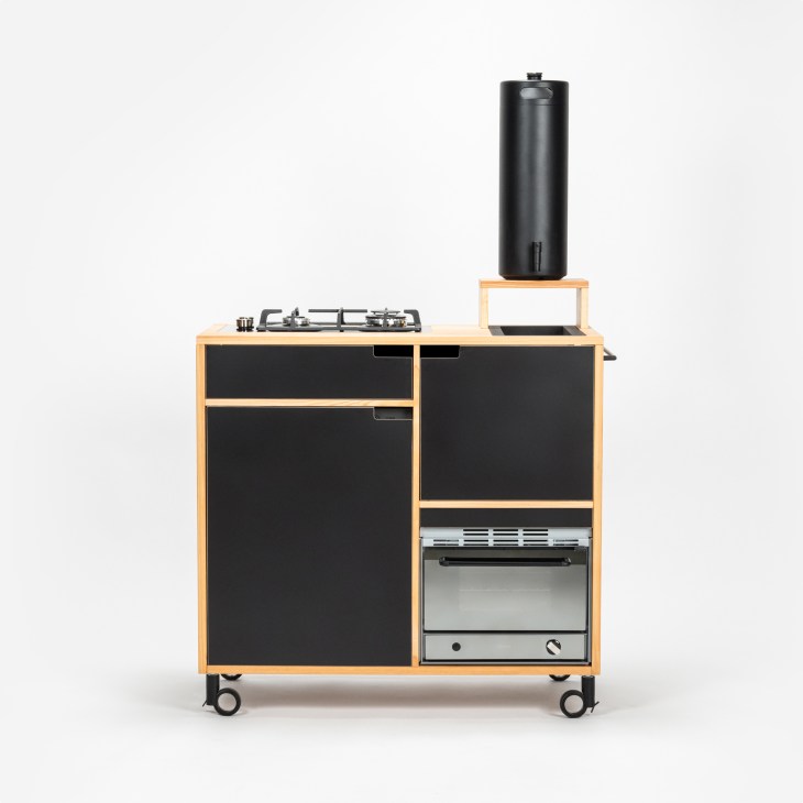 Tinyküche compact kitchen in natural wood finish showing free-standing modular design