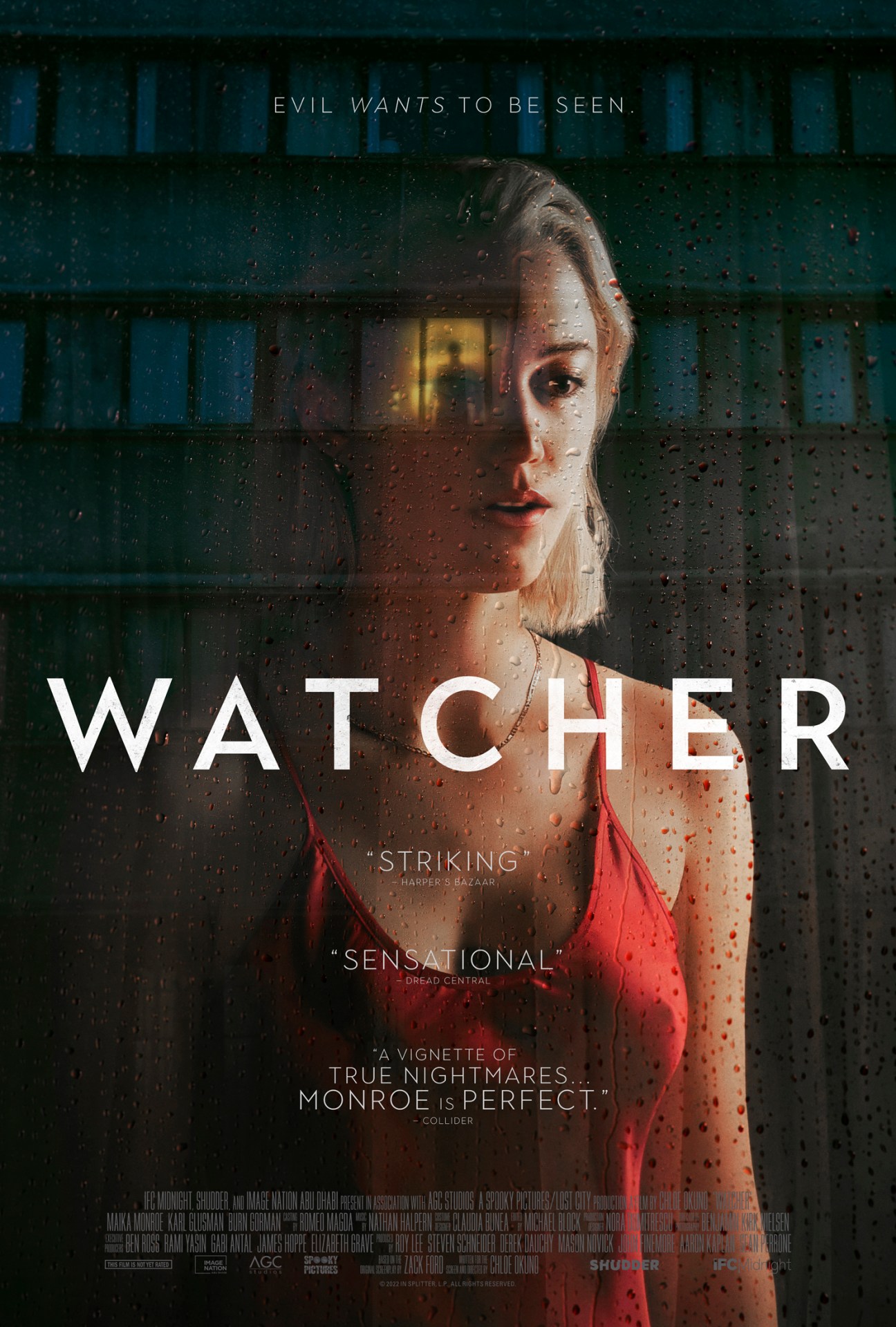 Movie poster for 'Watcher' showing a woman's face behind a wet window with industrial background.