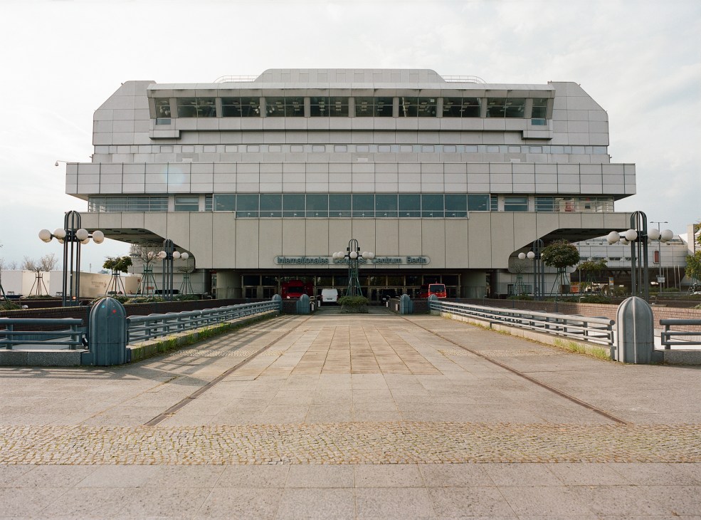 The International Congress Centre's main southern entrance, a large brutalist concrete and aluminium building with tiered levels and geometric design.