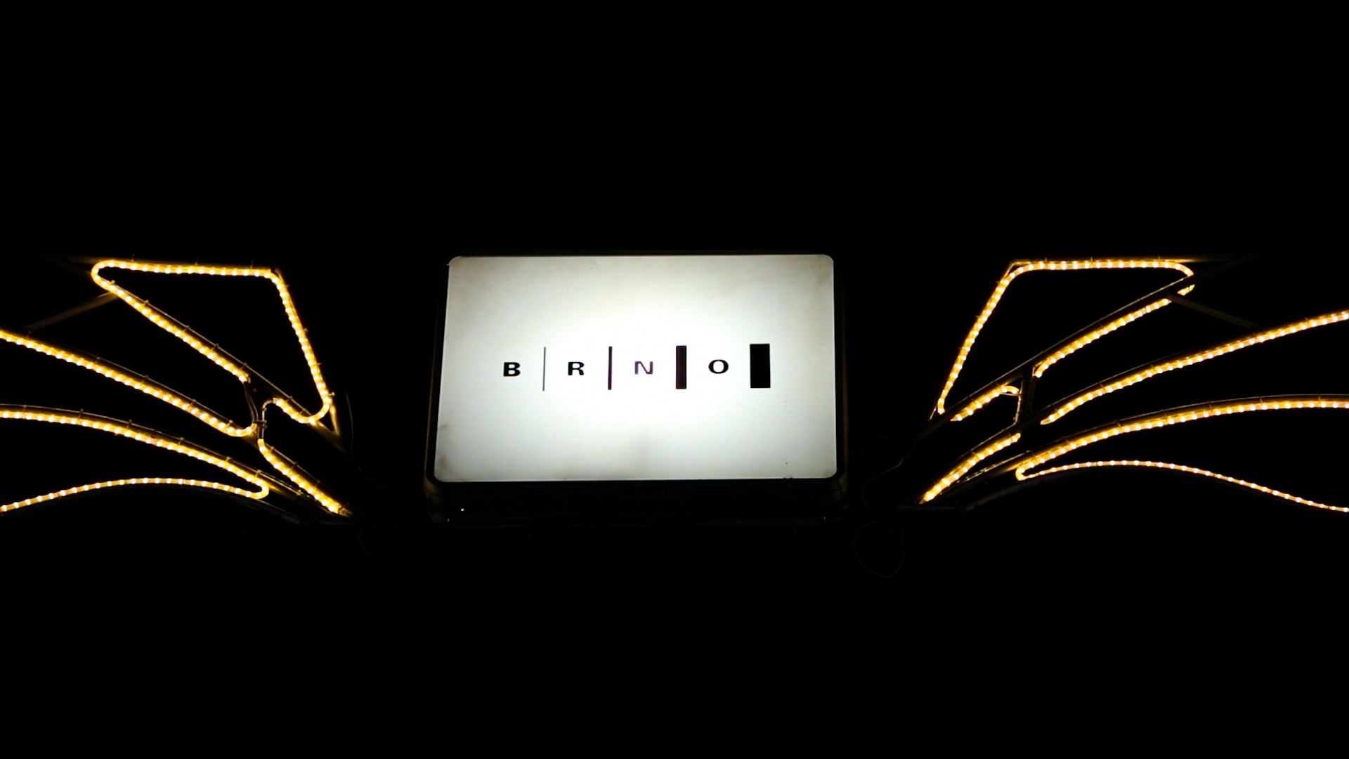 Illuminated sign on one of the streets in Brno.