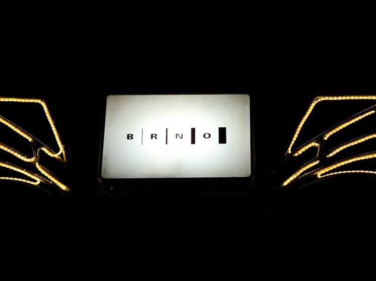 Illuminated sign on one of the streets in Brno.