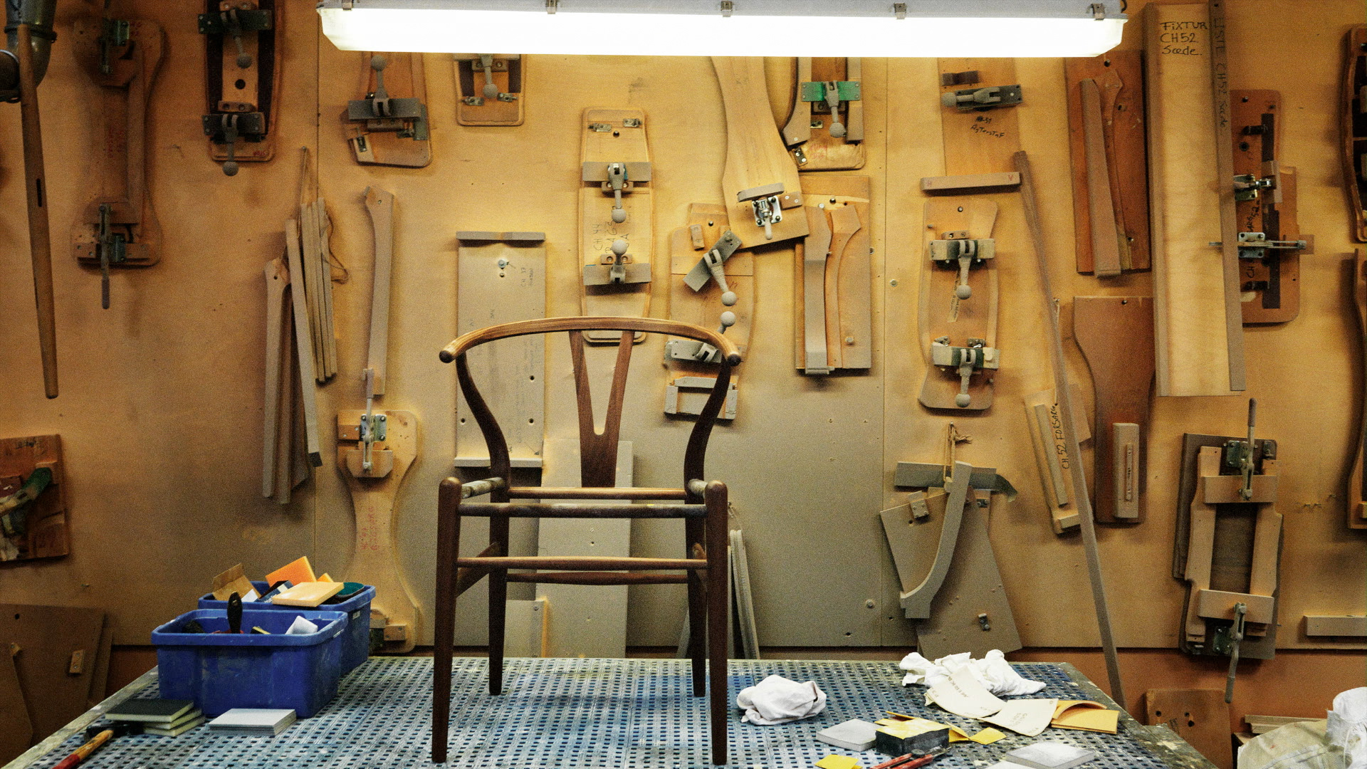 A chair and tools in a workshop.