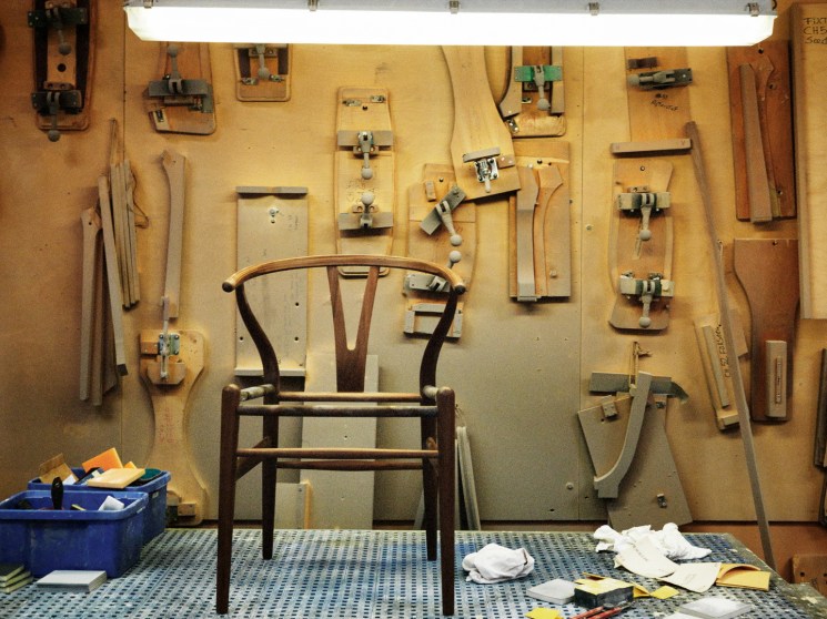 A chair and tools in a workshop.