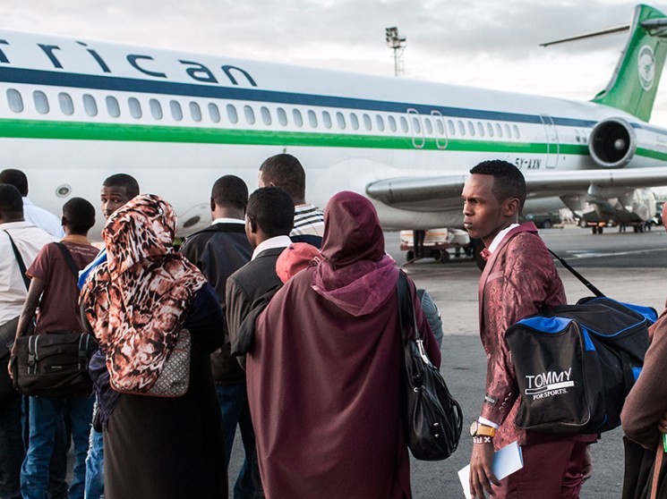 People boarding a plane.