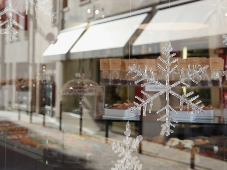 Glass snow flakes in a shop window.