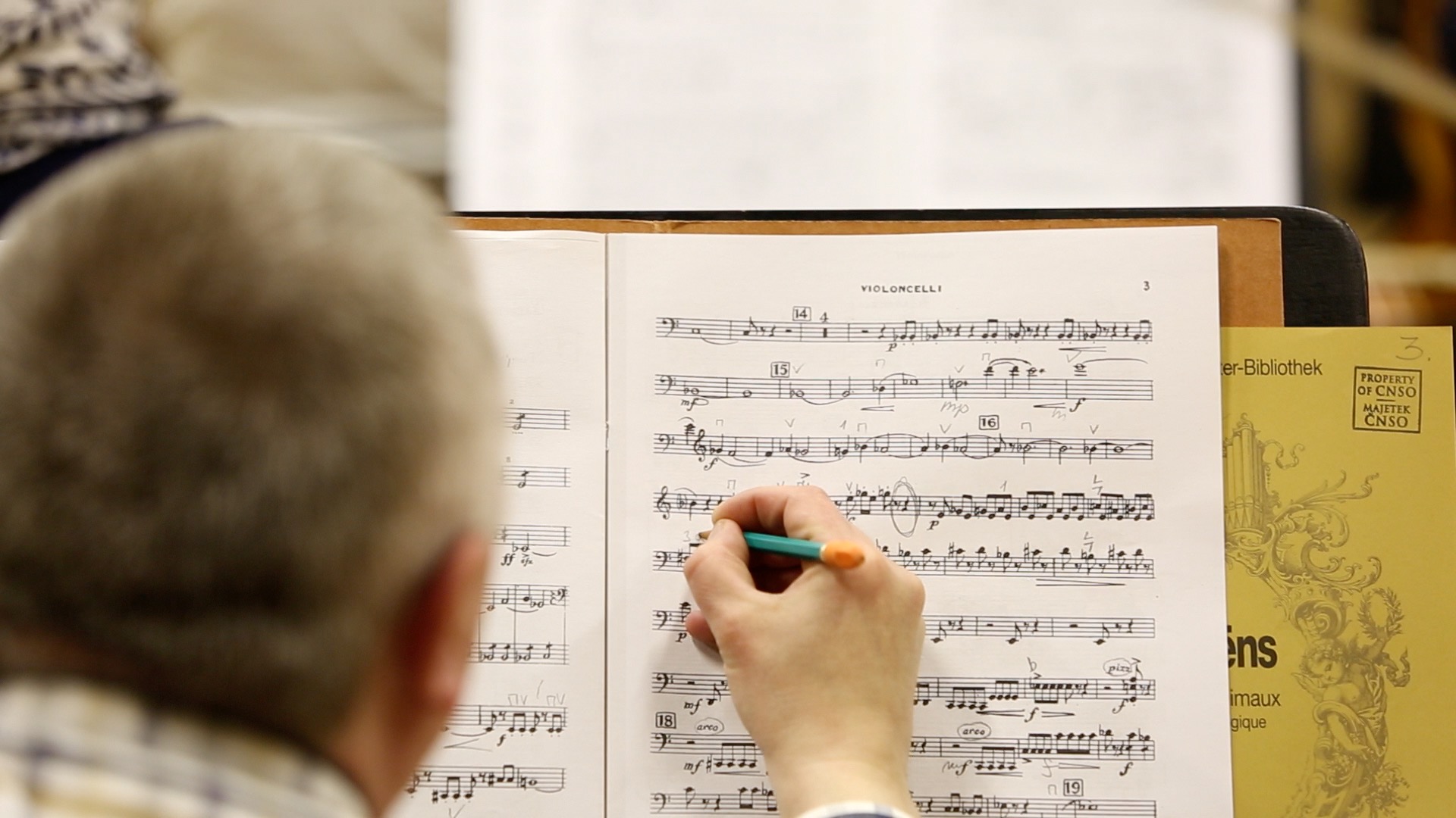 A musician amending the score.