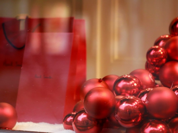 Christmas baubles in a window display.
