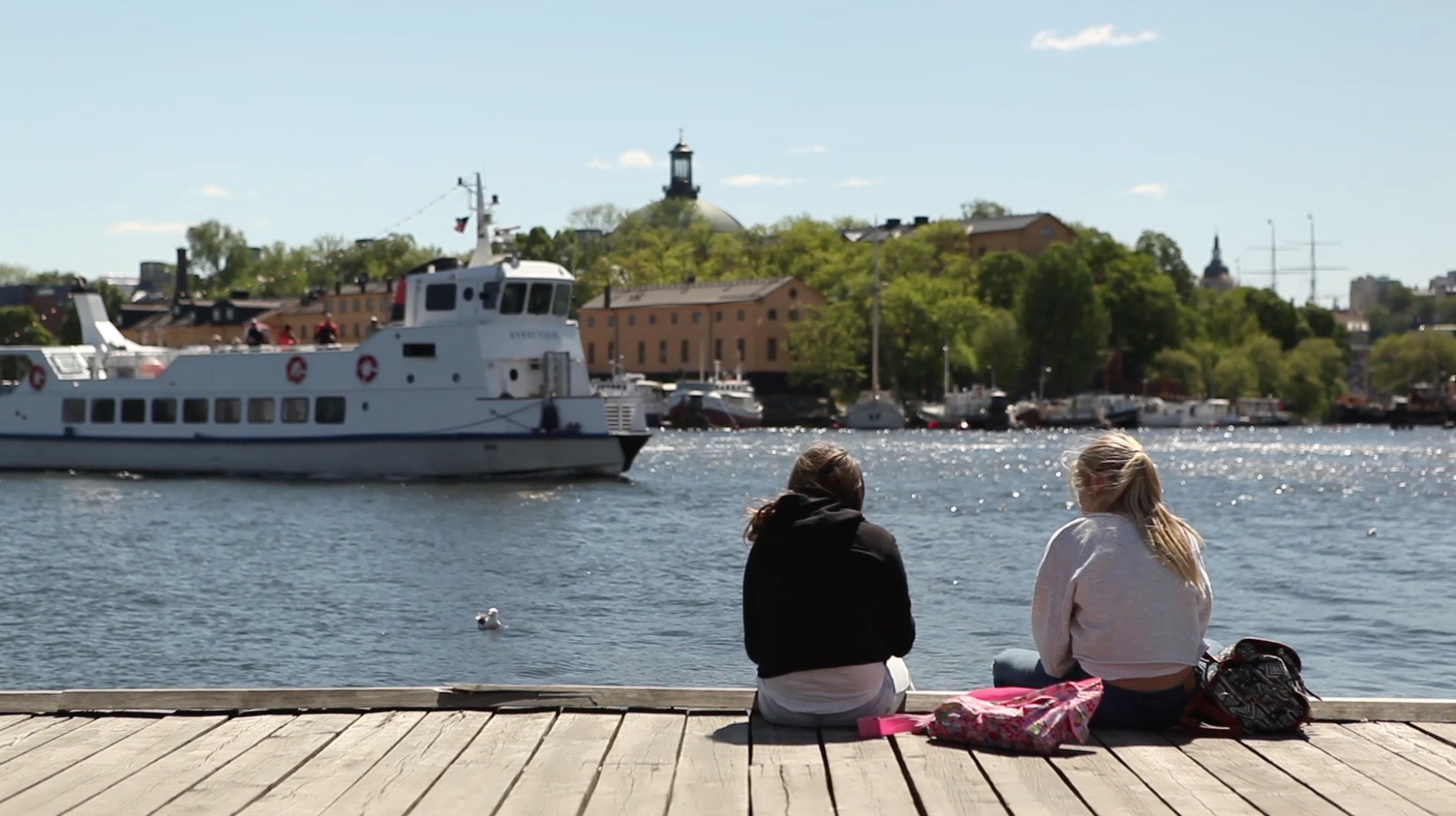 Two girls relaxing by the Stockholm waterfront