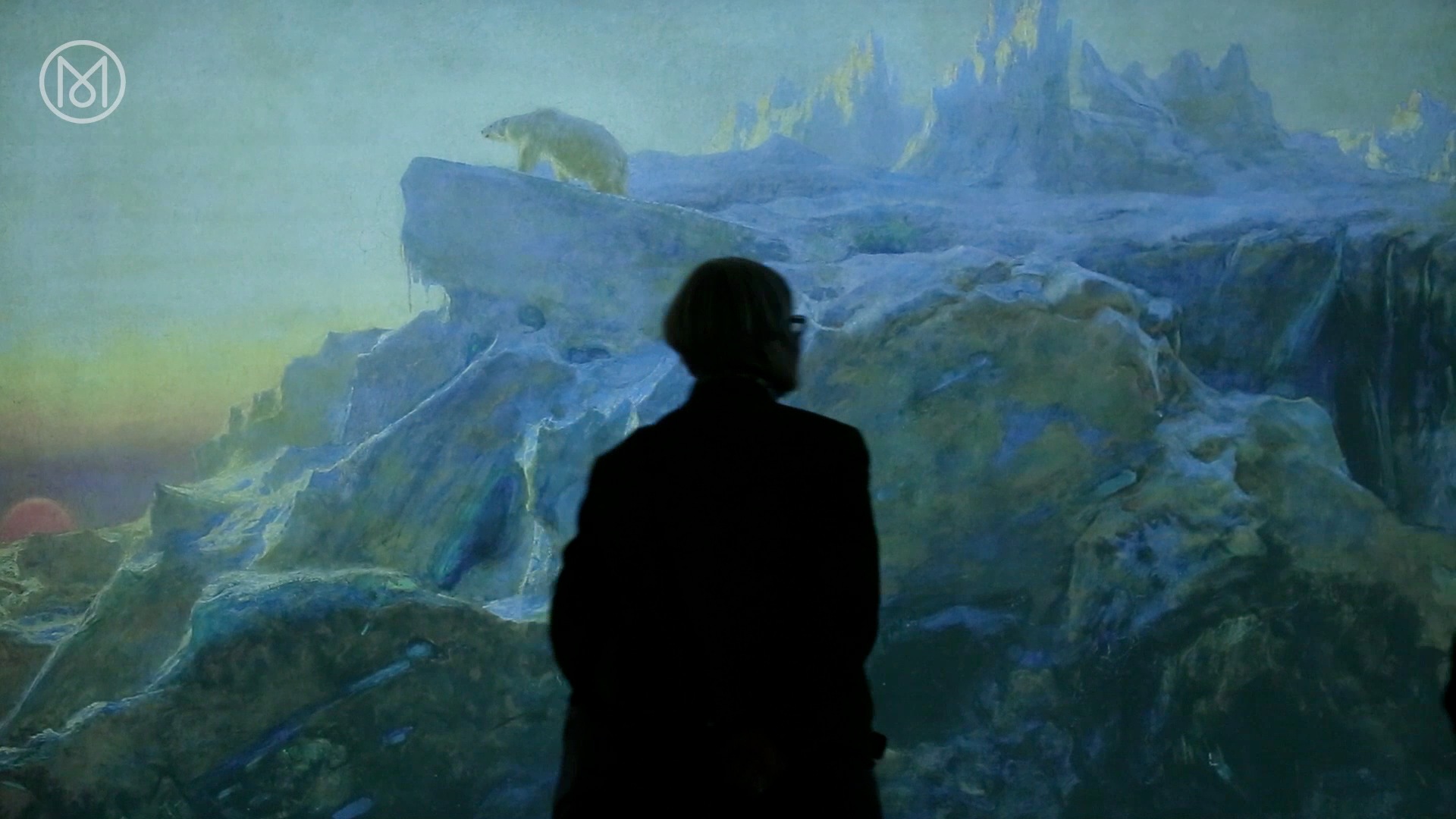 A visitor exploring an exhibition space.