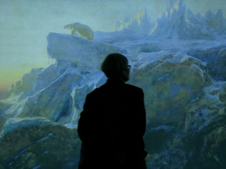 A visitor exploring an exhibition space.