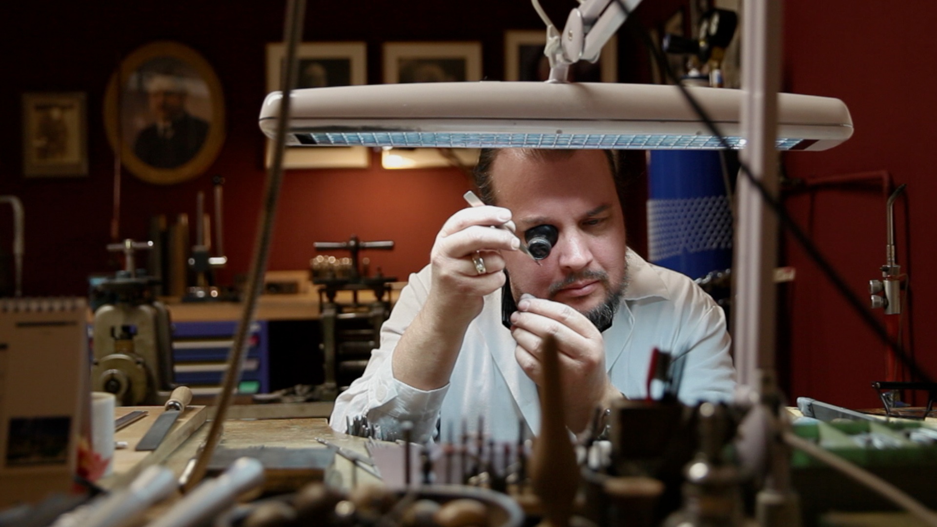 Jeweller working in his workshop.