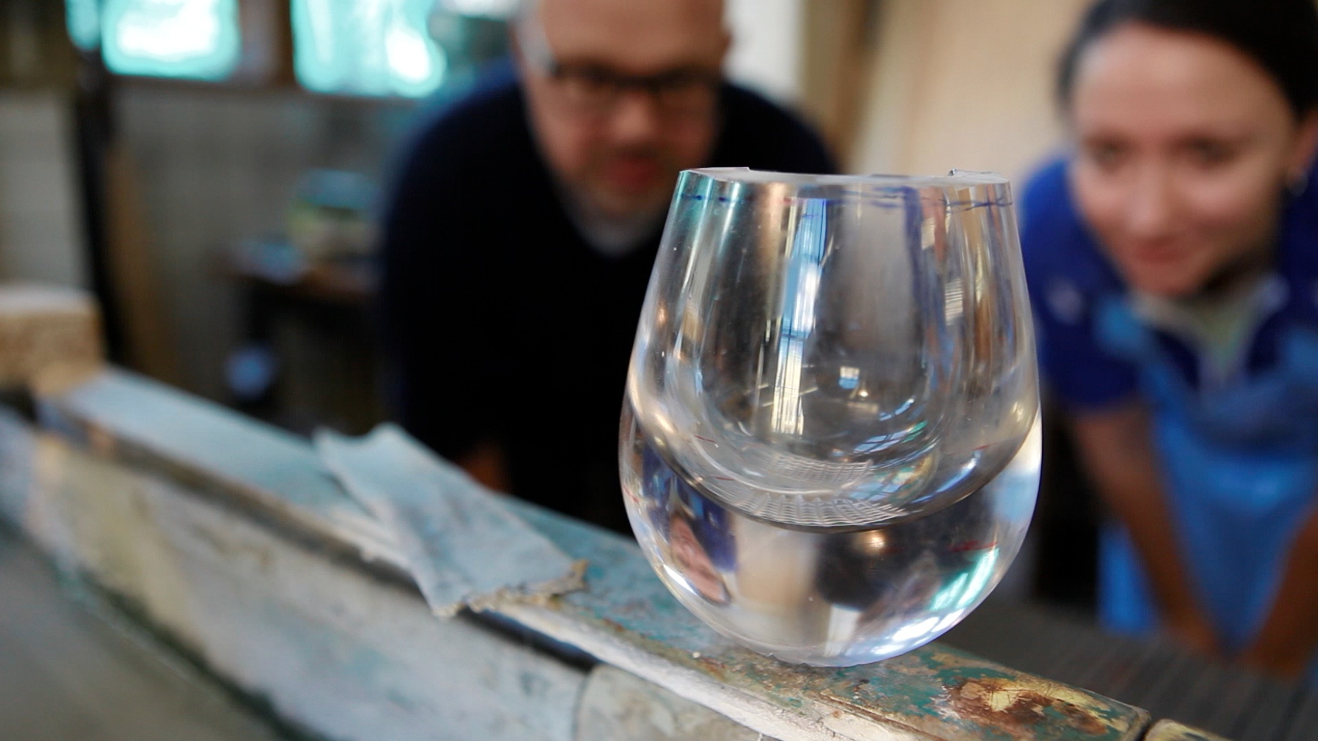 Makers observing a glas.