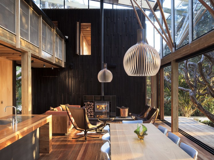A wooden interior with a fireplace.