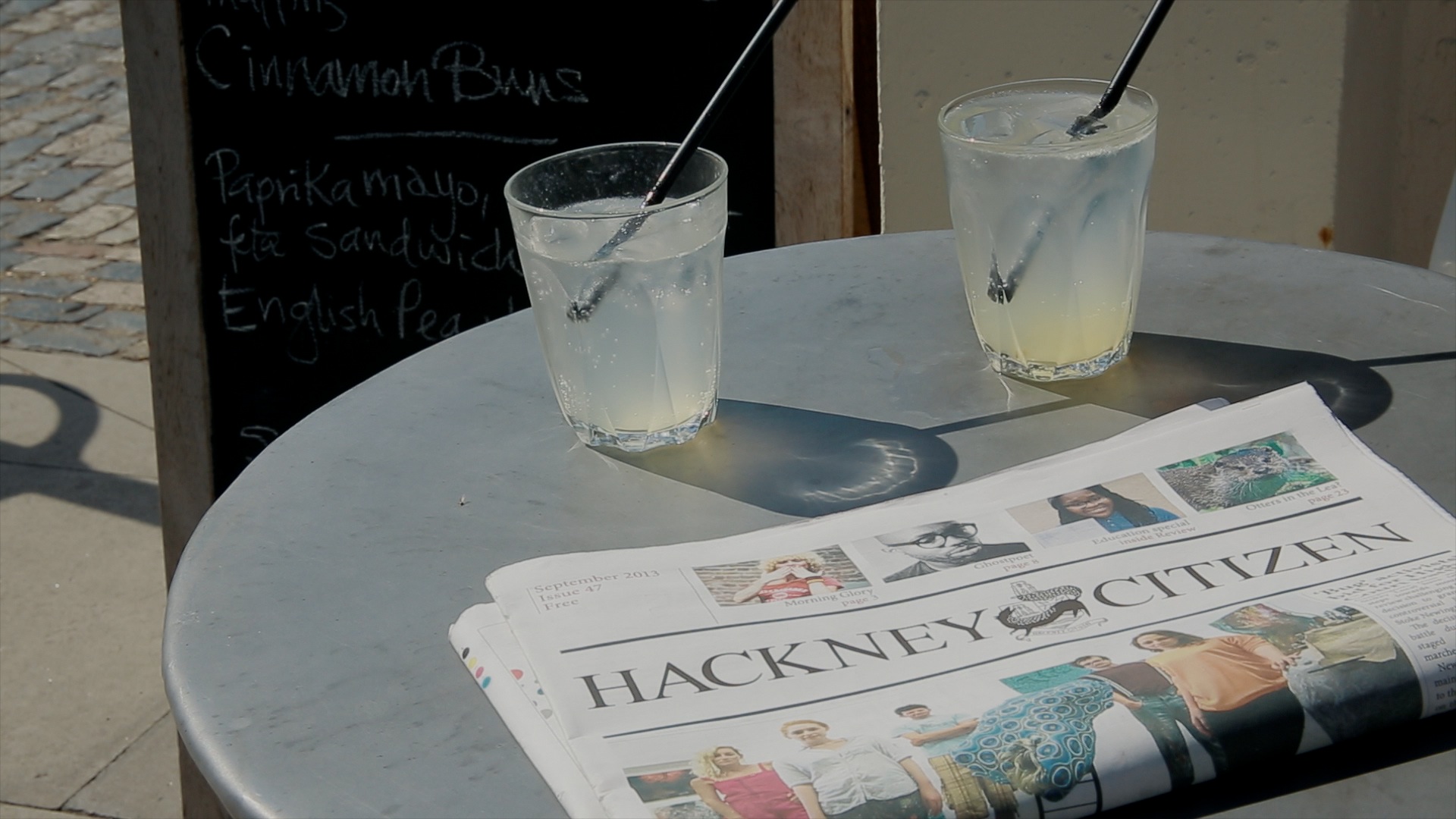newspaper and drinks on a table