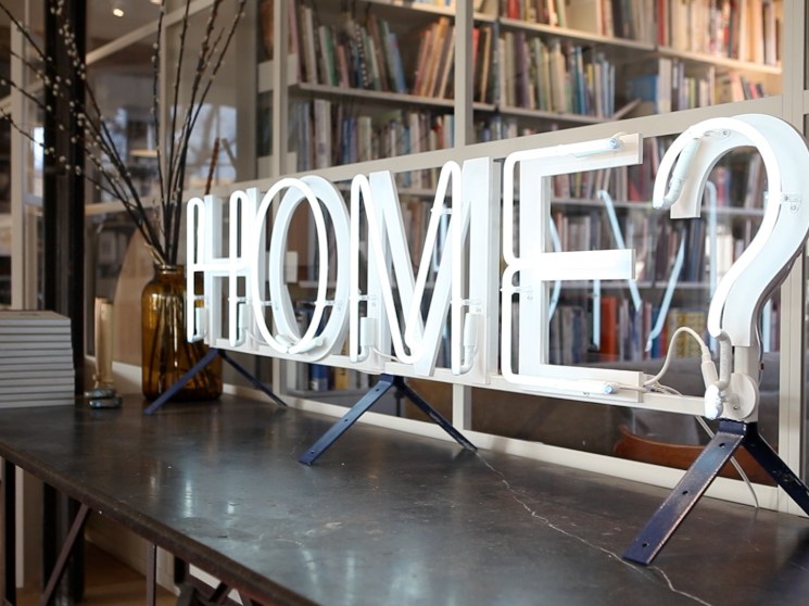 An illuminated sign in an office.