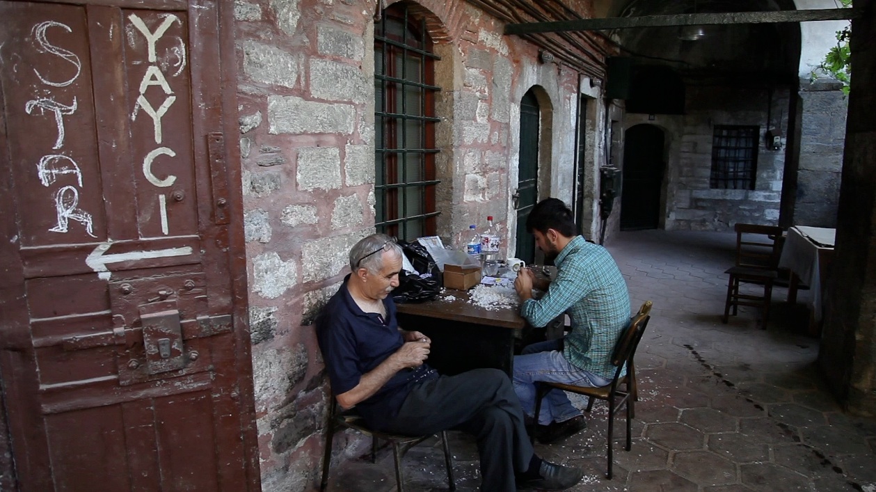 men sat in a courtyard