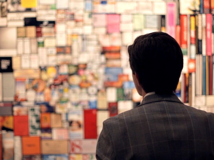 A man observing a work of art.