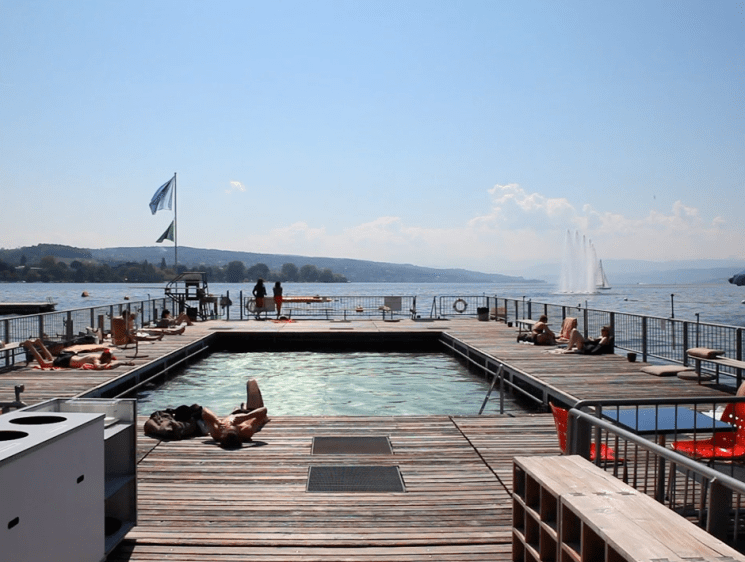 people by swimming pool and lake