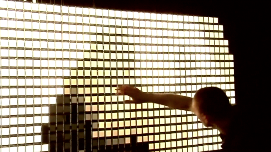 person looking at video art installation