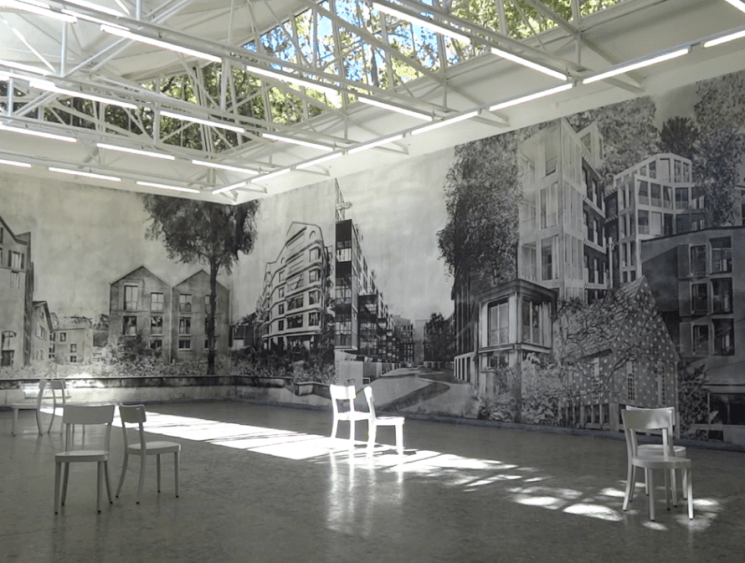 exhibition room with chairs and graffiti