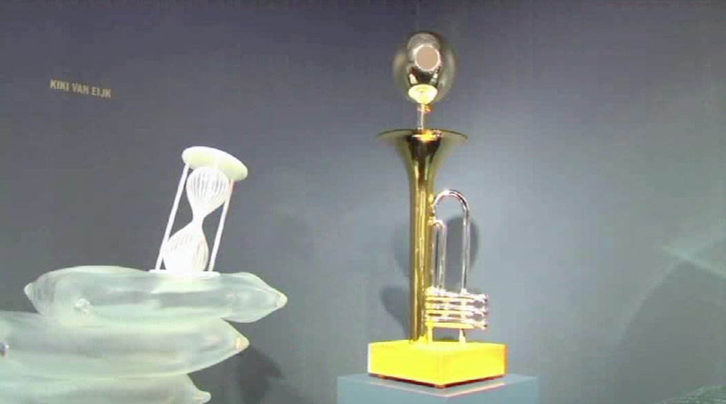 toy hourglass and toy trumpet