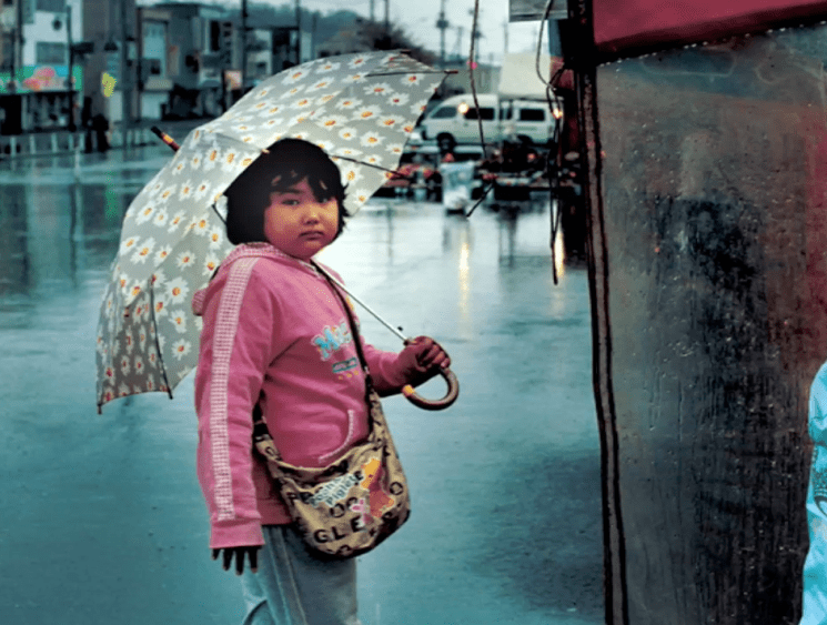 child with umbrella