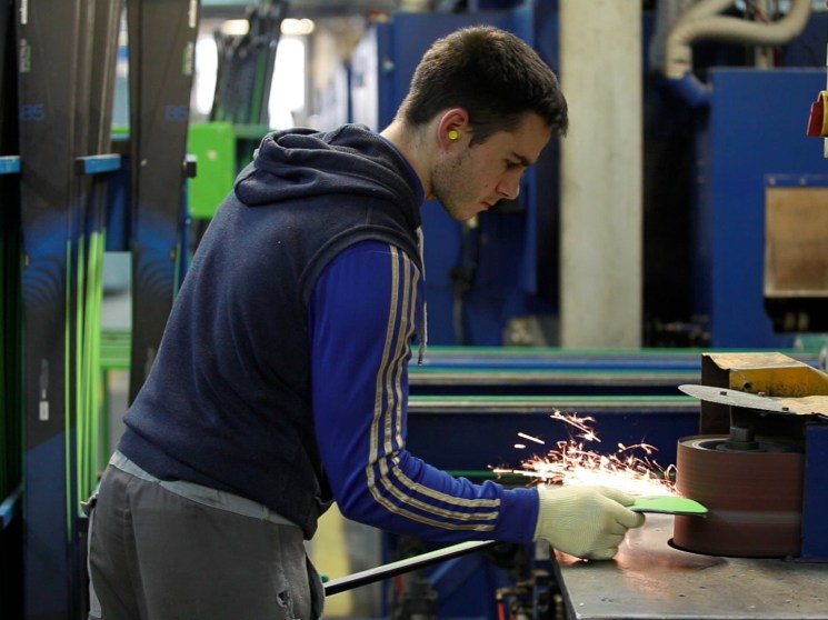 A man making skis by hand.