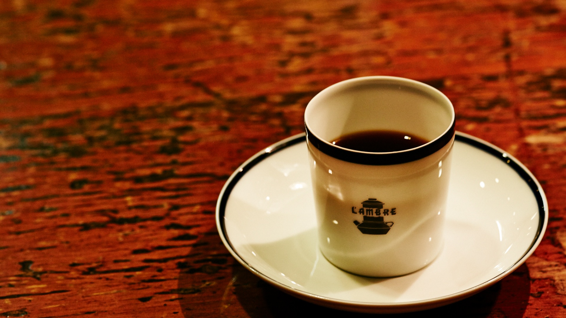 A coffee cup on a table.