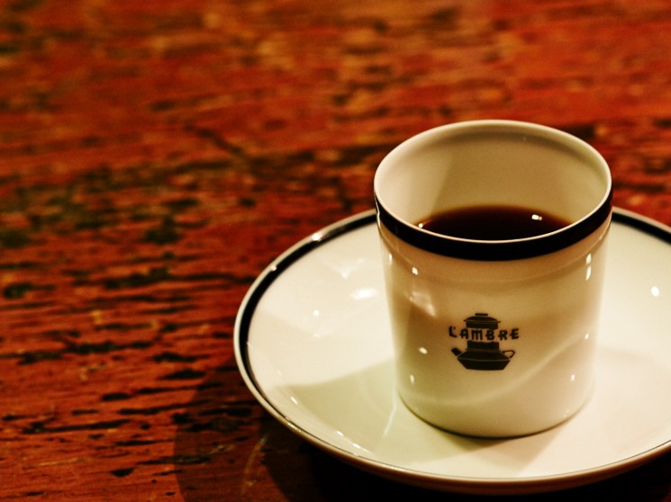 A coffee cup on a table.