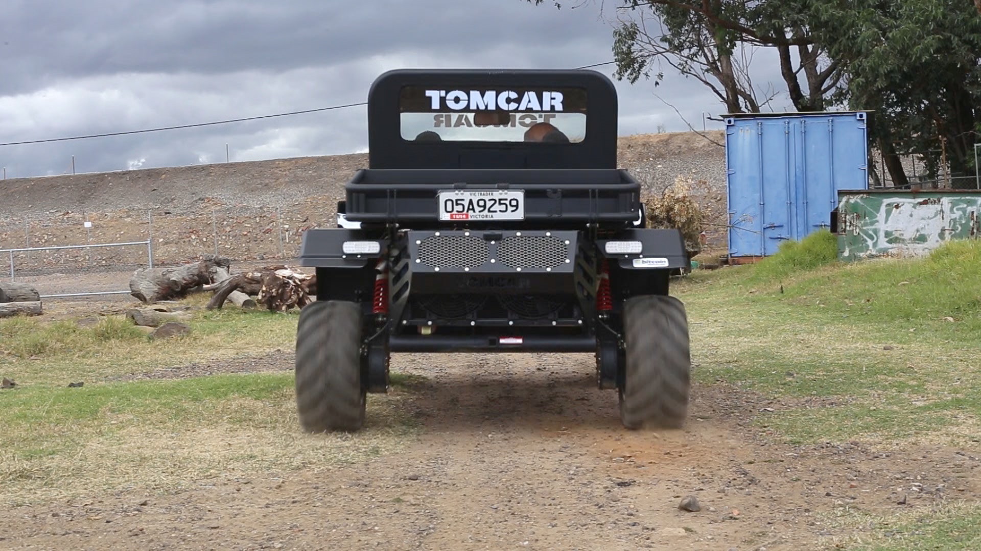 Tomcar parked in the garden.