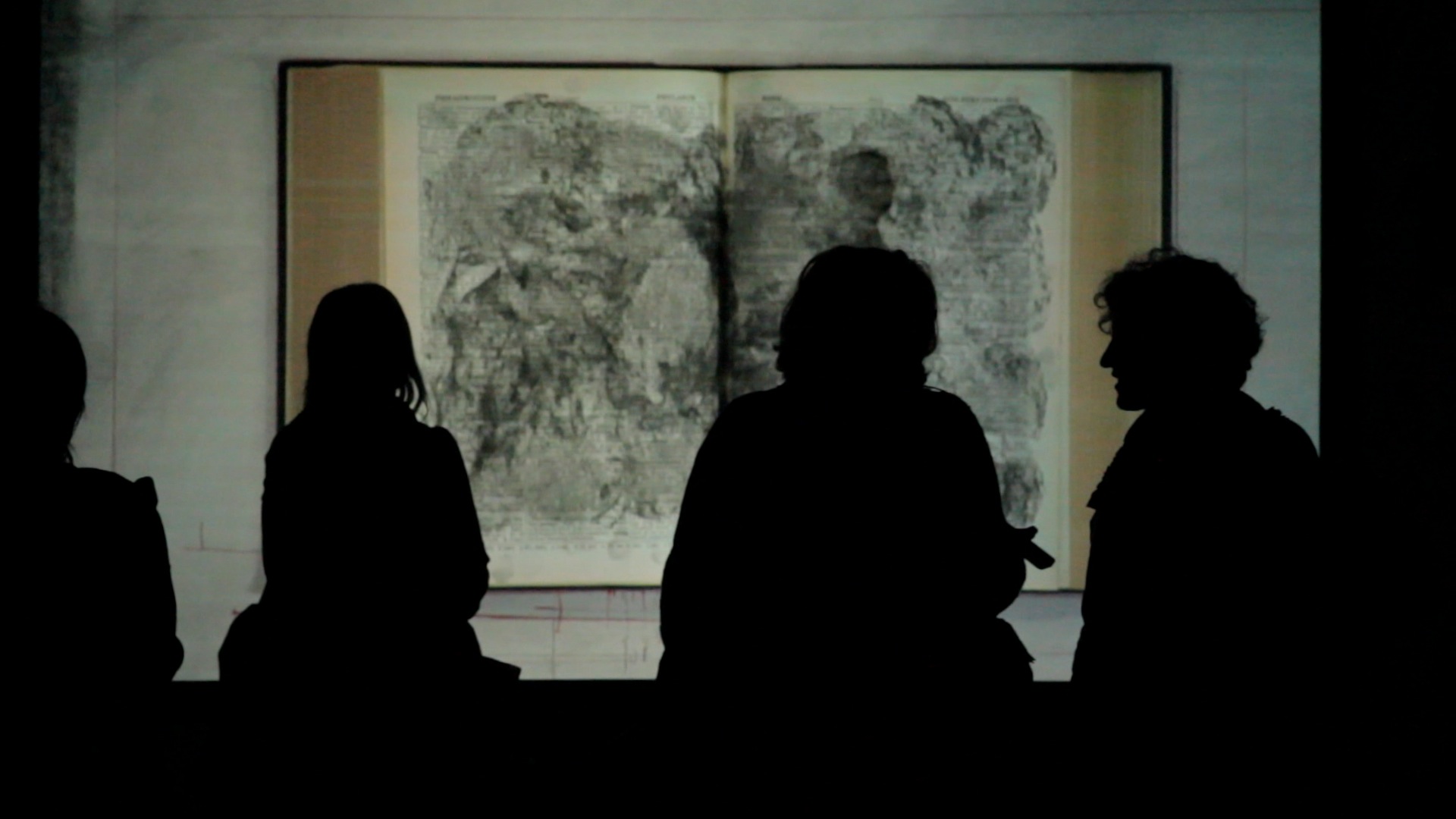 People observing a work of art.