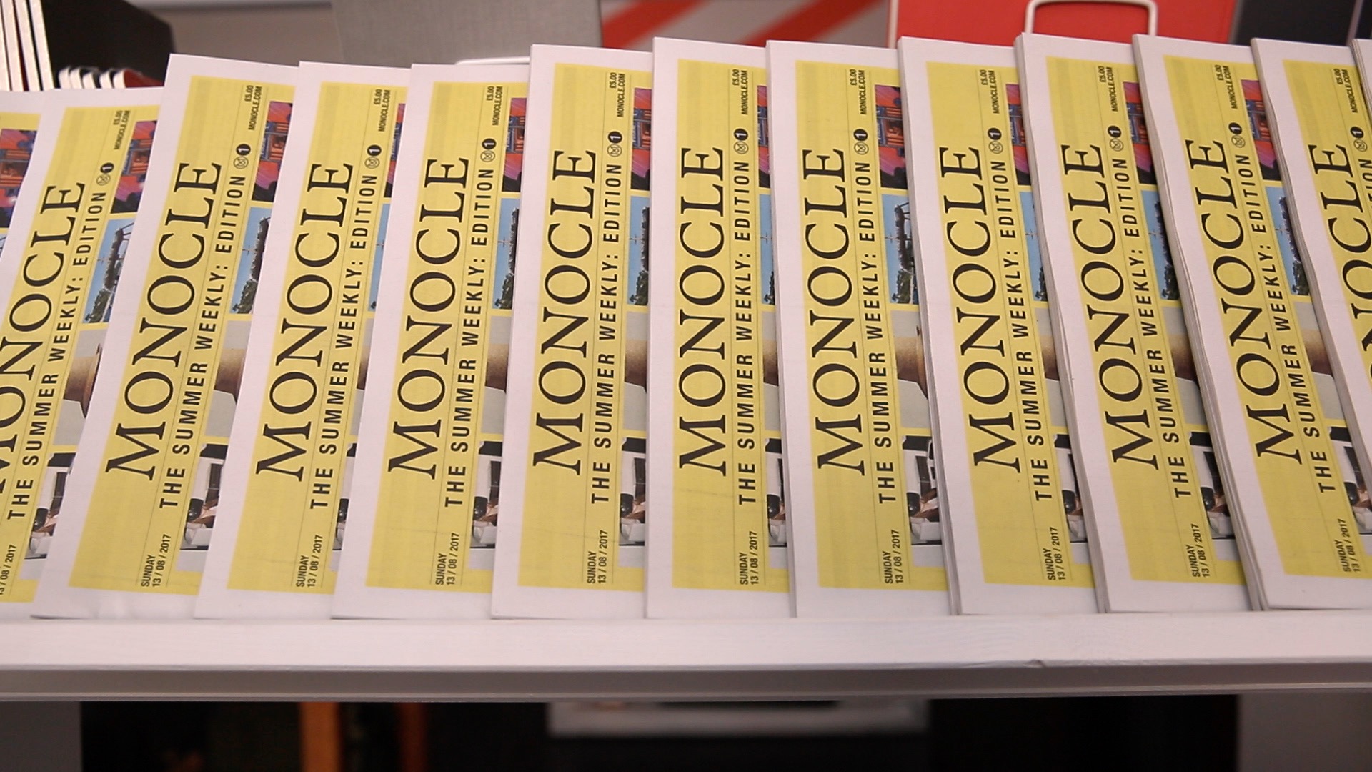 The Monocle Summer Weekly on display in a shop.