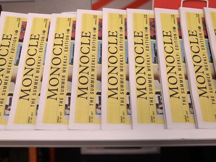 The Monocle Summer Weekly on display in a shop.